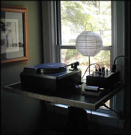 Turntable wall shelf mounted in window frame